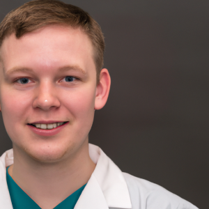 a professional and visually appealing image of a young happy smiling caucasian doctor with white teeth