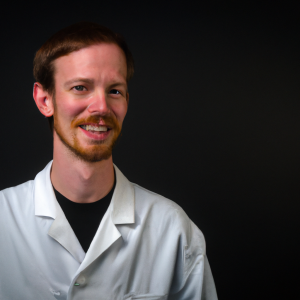 a professional and visually appealing image of a young happy smiling caucasian doctor with white teeth