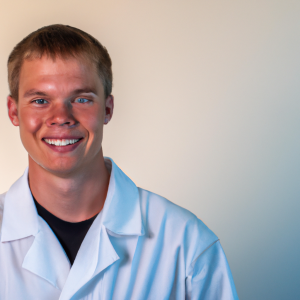 a professional and visually appealing image of a young happy smiling caucasian doctor with white teeth