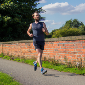 a professional appealing image of a caucasian man or woman jogging on a sunny day 165 300x300