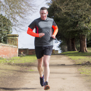 a professional appealing image of a caucasian man or woman jogging on a sunny day