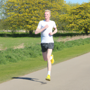 a professional appealing image of a caucasian man or woman jogging on a sunny day