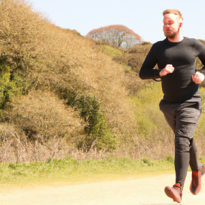 a professional appealing image of a caucasian man or woman jogging on a sunny day 475 300x300